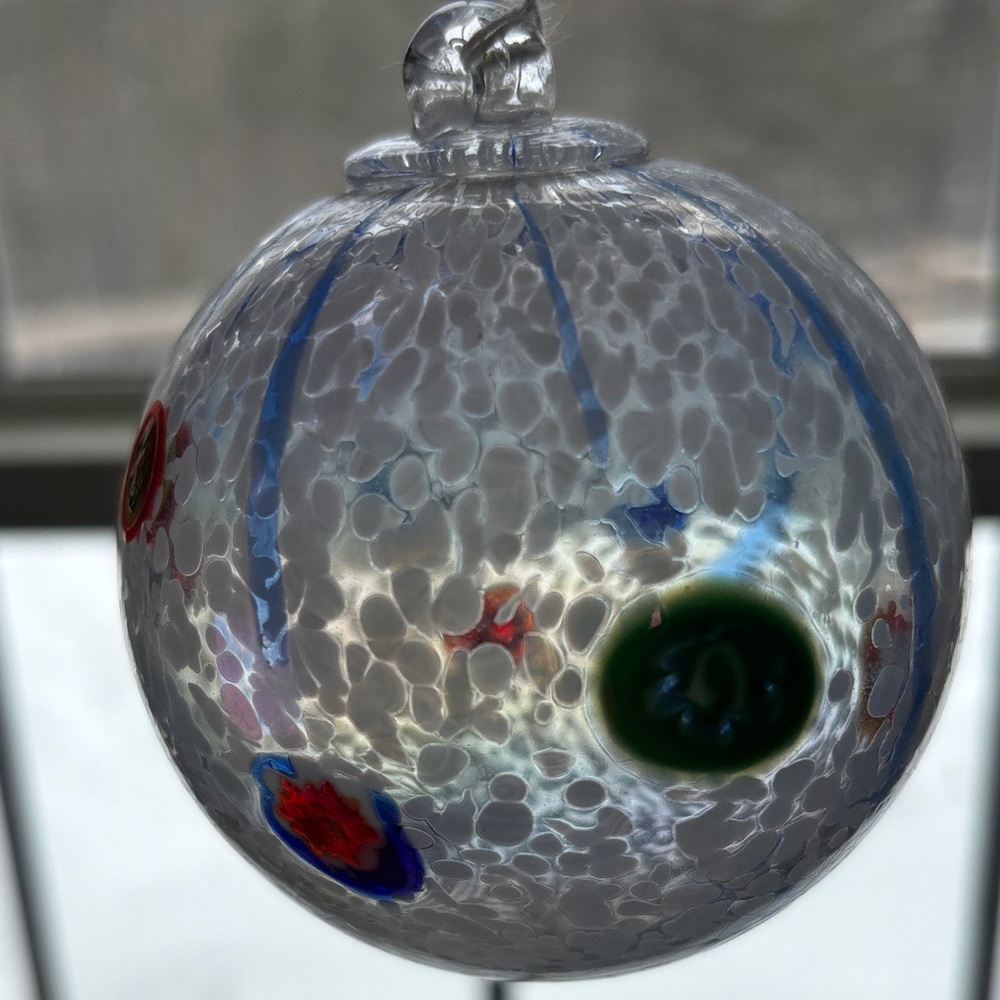Handcrafted Blown Glass Ornament with Red and Blue Accents - Picture 4 of 4